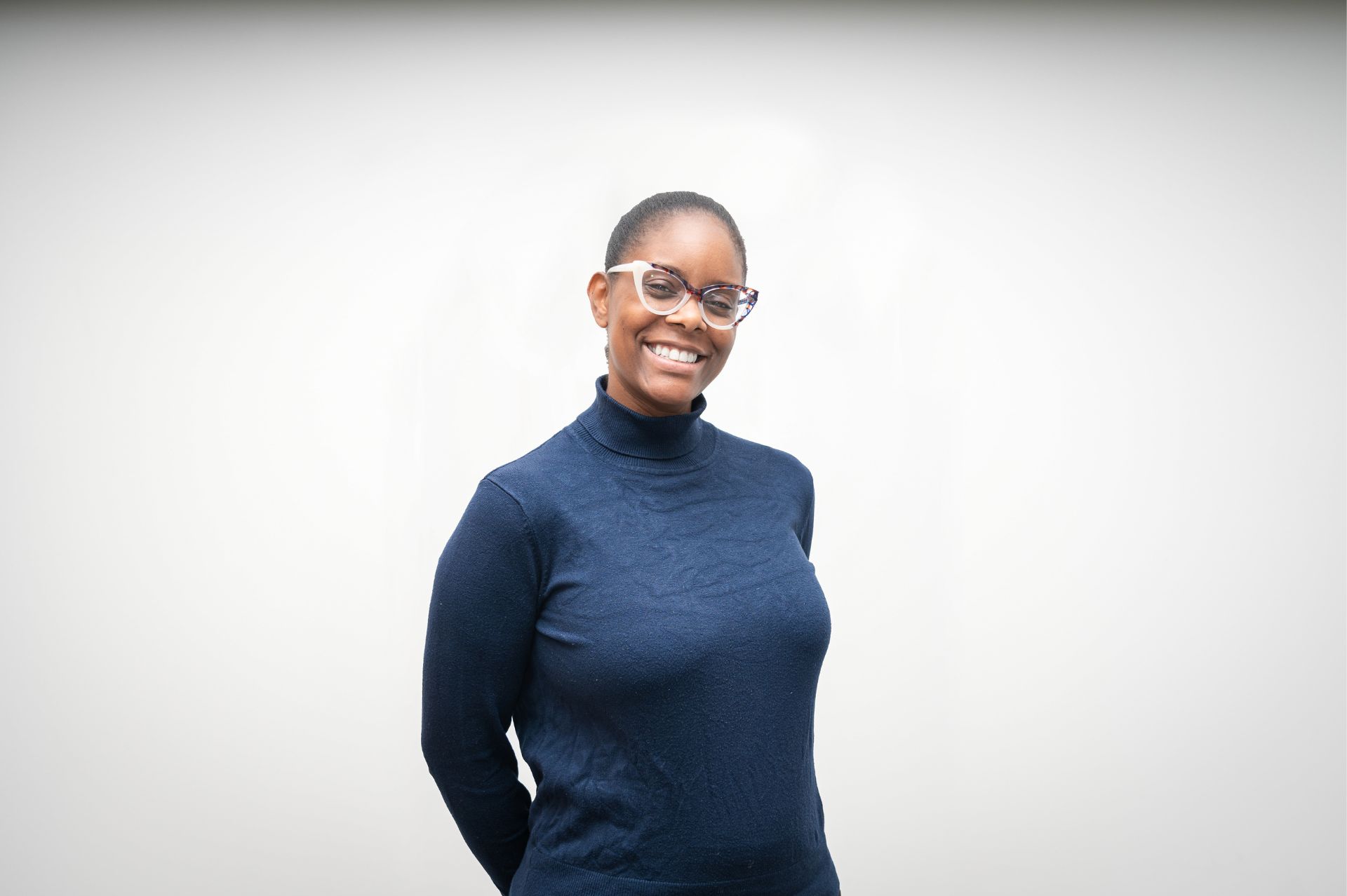 Tanya Daye wearing a blue top against a plain backdrop