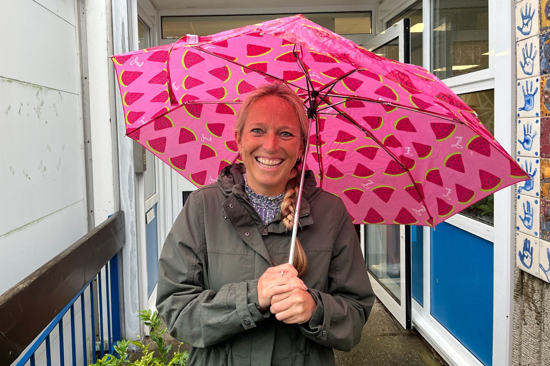 Pewley Down headteacher, Vicky Ellis, smiling outside the school under her umberella