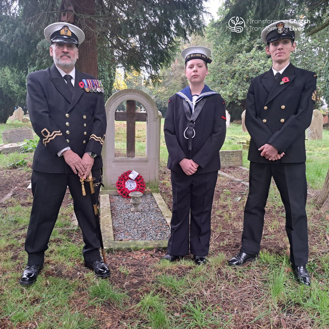 Service men stand next to the grave of Admiral of the Fleet Sir Doveton Sturdee in the churchyard of St Peter's Frimley