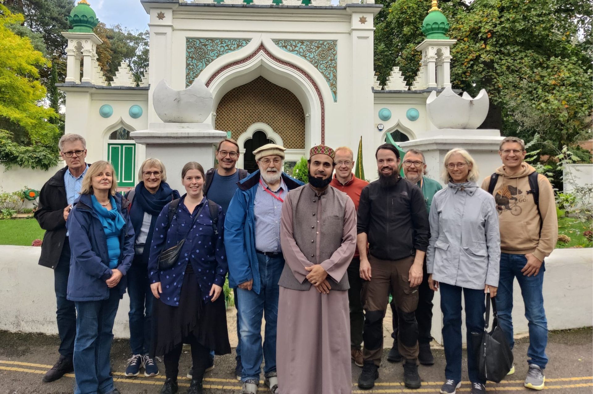 Clergy from Viborg and Guildford dioceses stand with Imam Saeed Hashmi outside the Shah Jahan Mosque in Woking