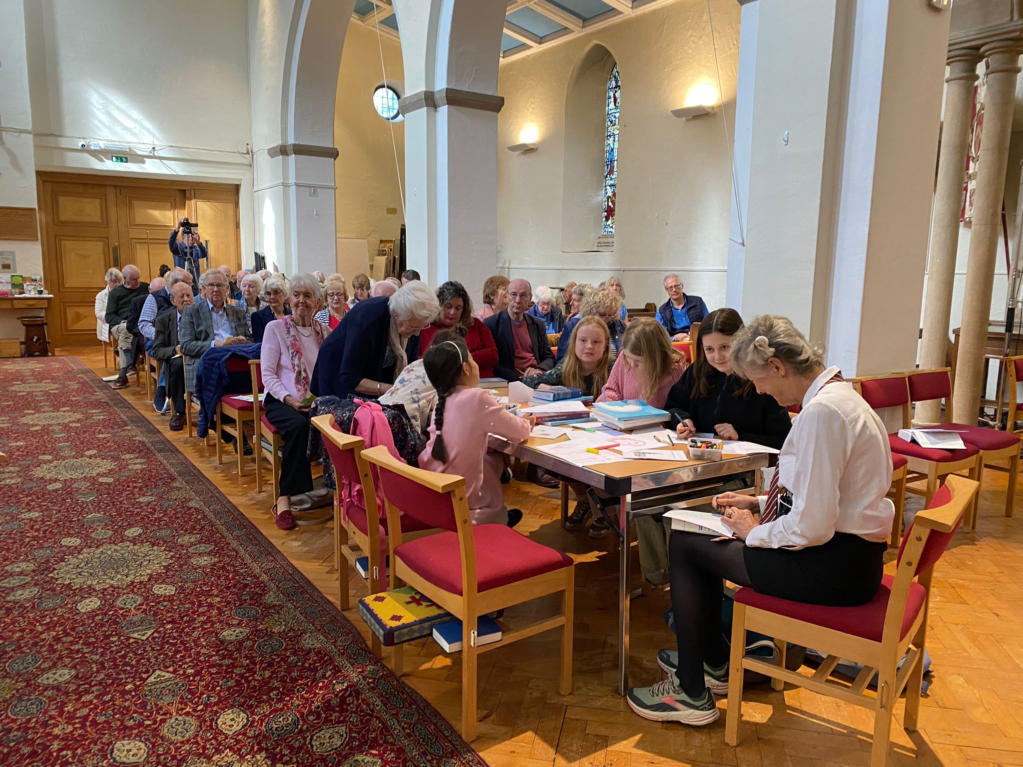 Group of young and old people meeting together in the church building