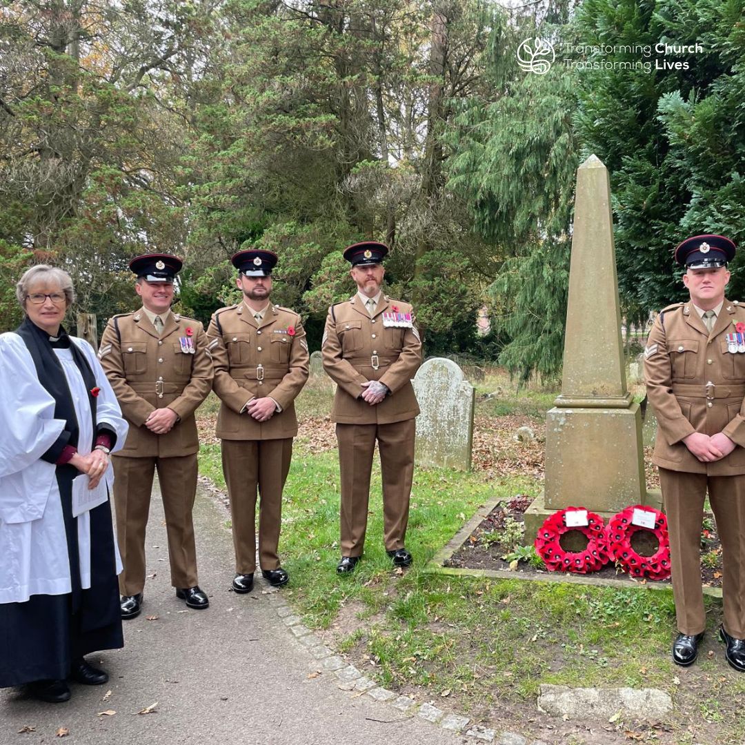 Revd Jackie Stone with the Royal Engineers next to the war memorial in St John's churchyard in Cove