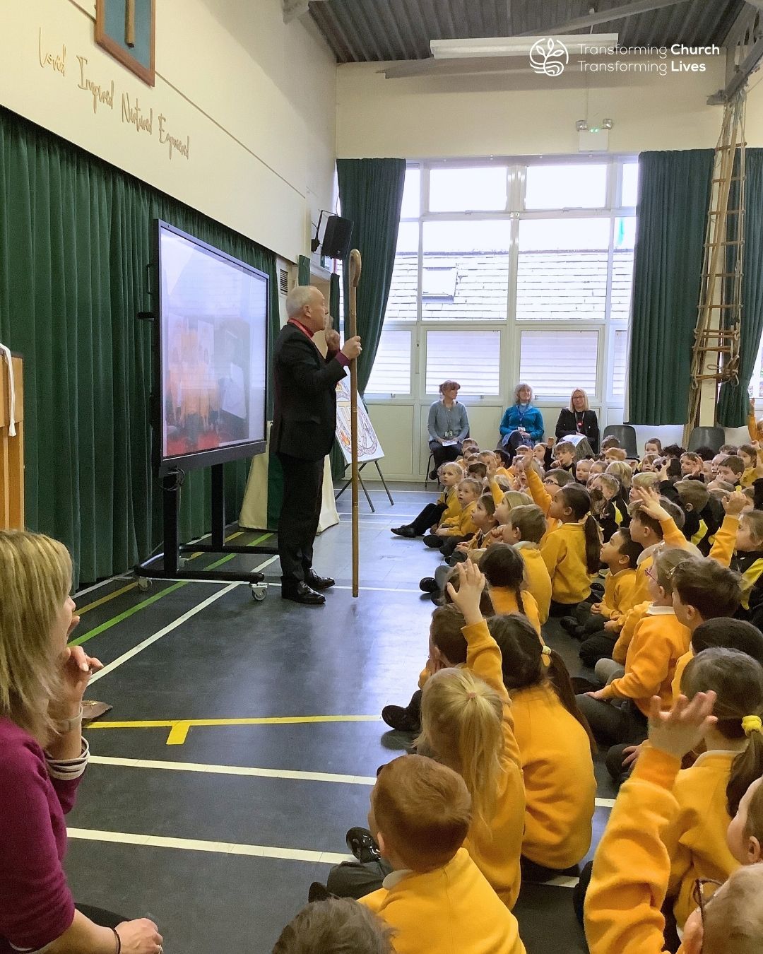 Bishop Paul leads a school assembly using his crook as an illustration