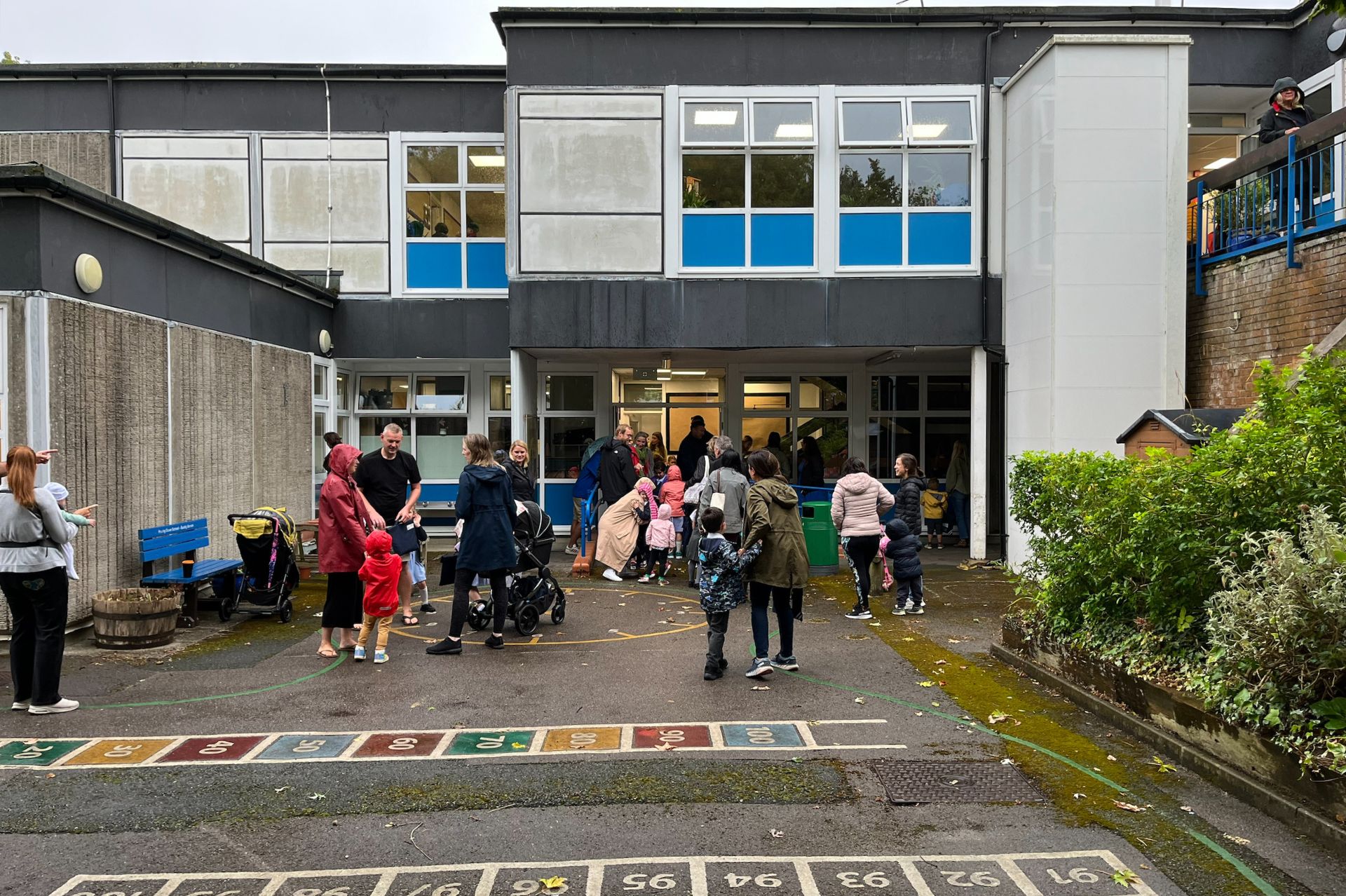 Parents dropping off pupils outside Pewley Down School